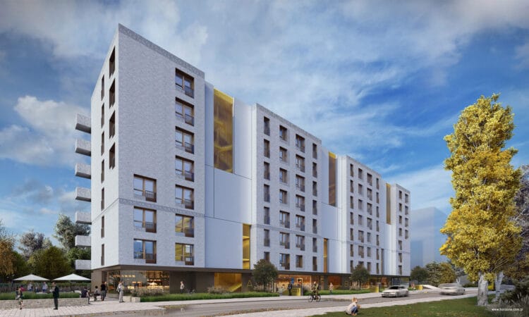 Zabudowa mieszkaniowa przy ulicy Portowej w Krakowie, widok na cały budynek o pierzejowej zabudowie.